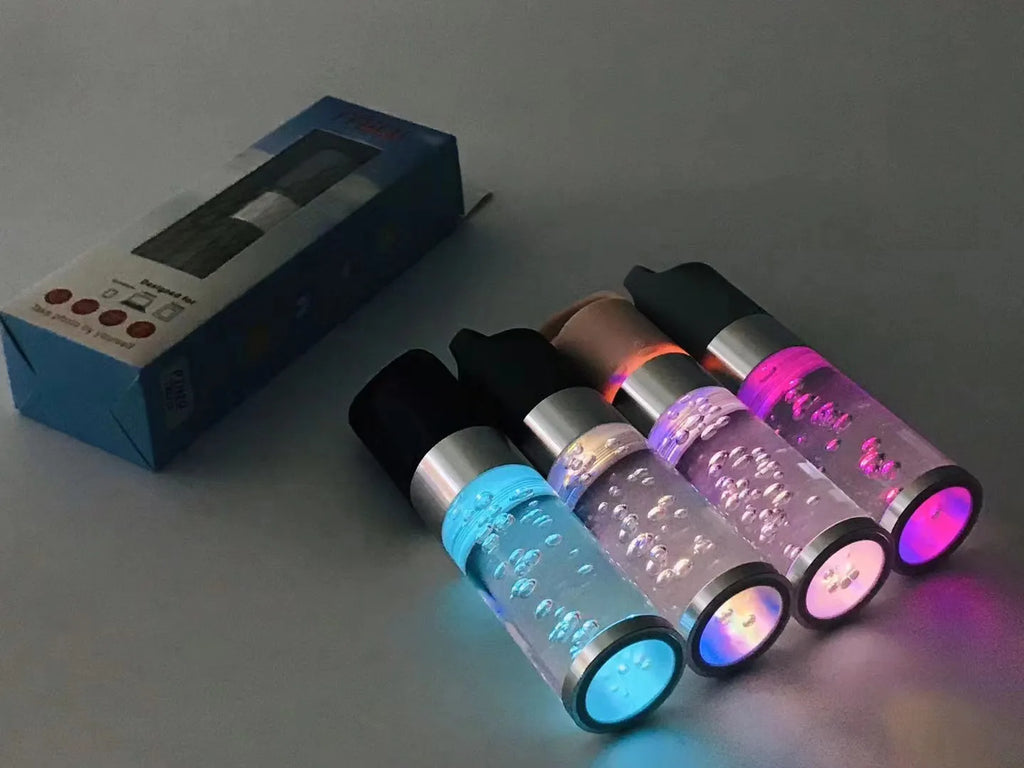 Portable Bluetooth speaker with coloured crystal lights in pink, black, silver grey, or green.