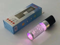 Portable Bluetooth speaker with coloured crystal lights in pink, black, silver grey, or green.