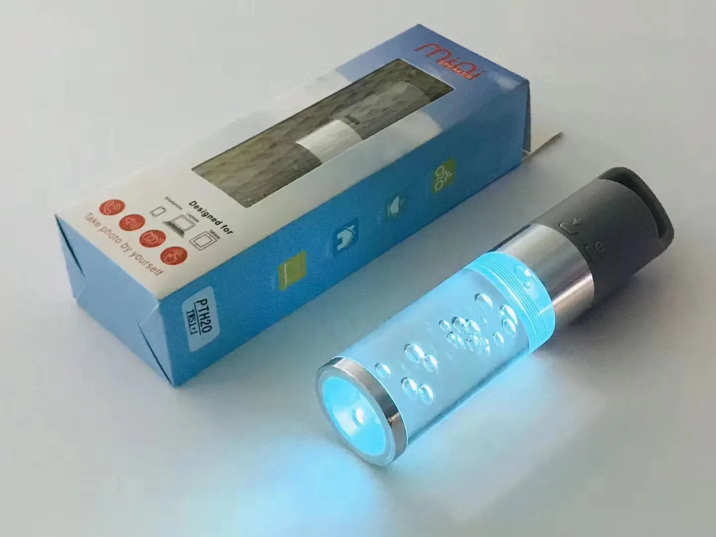 Portable Bluetooth speaker with coloured crystal lights in pink, black, silver grey, or green.