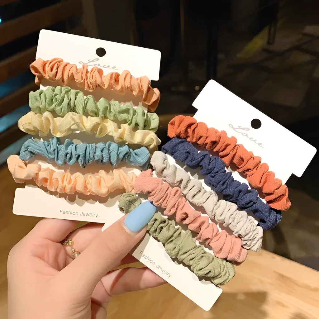 Children's hair accessories set showing autumn colour rings and dark macaron style clips