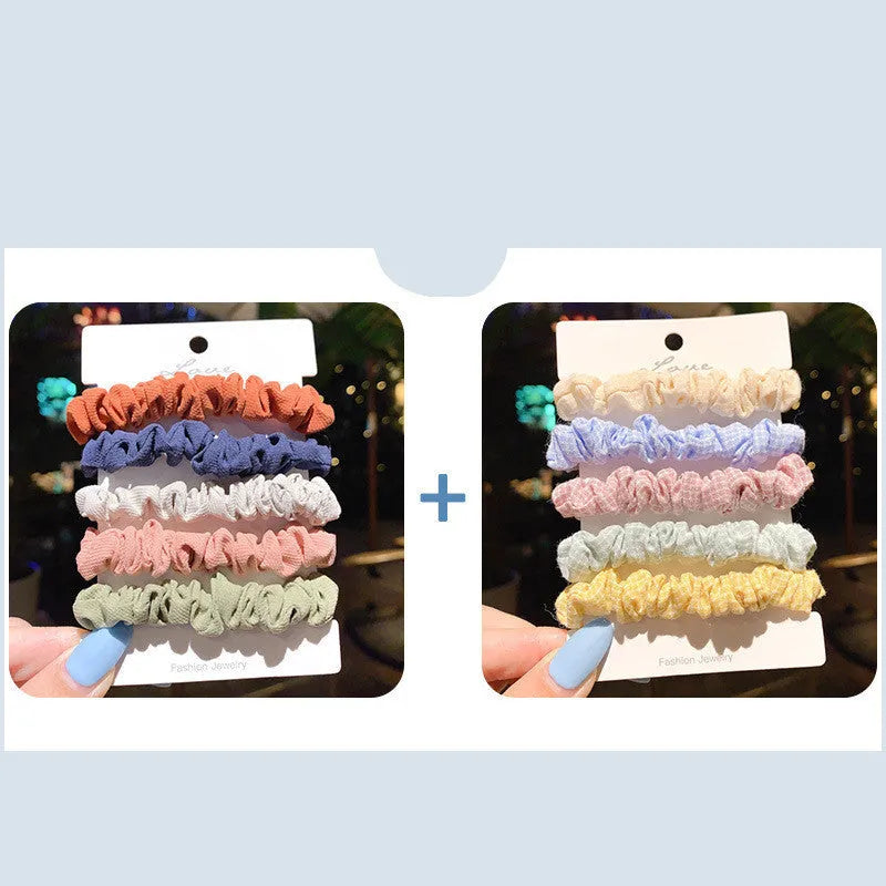 Children's hair accessories set showing autumn colour rings and dark macaron style clips