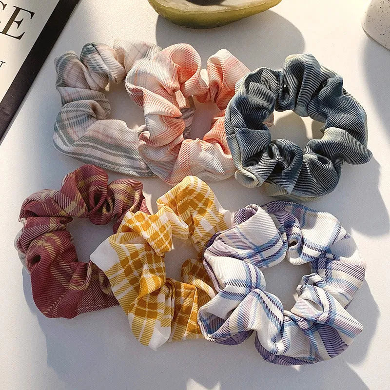 Children's hair accessories set showing autumn colour rings and dark macaron style clips