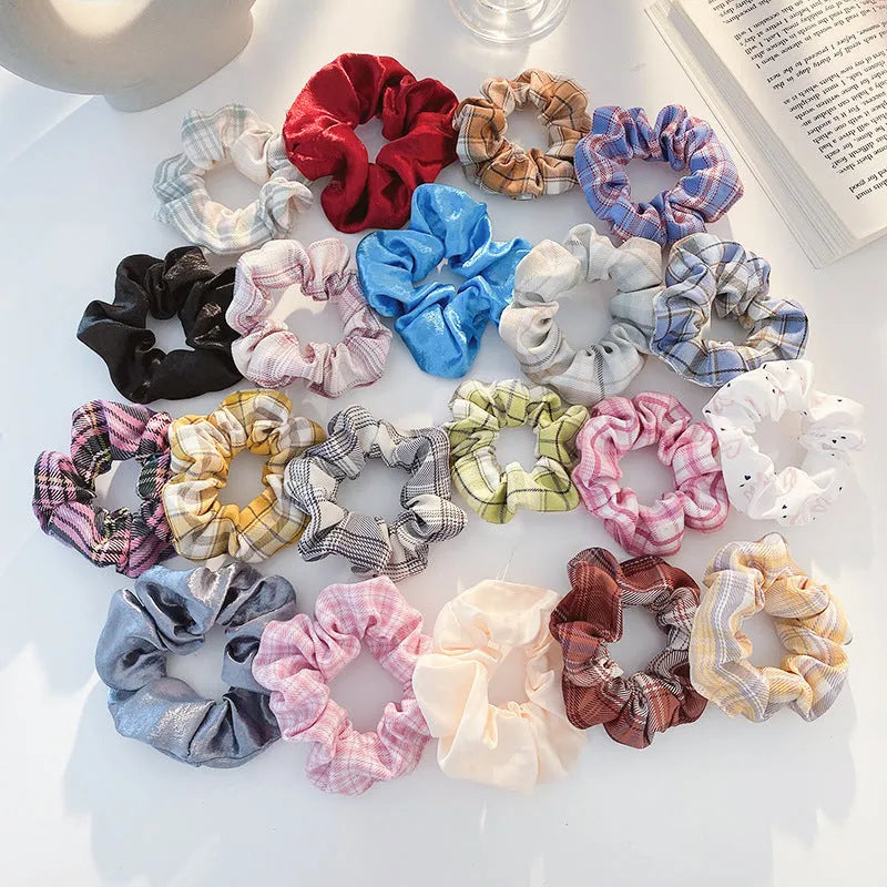 Children's hair accessories set showing autumn colour rings and dark macaron style clips
