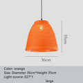 Woven rattan ball hanging lamp with adjustable cord on a light background.