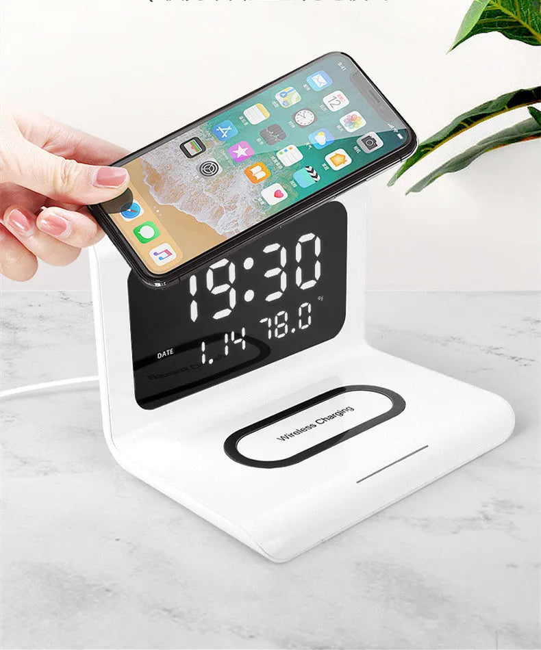 White wireless charger alarm clock showing perpetual calendar display with temperature and humidity readings
