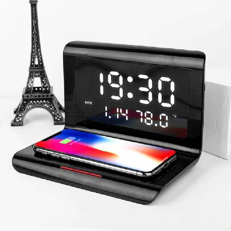 White wireless charger alarm clock showing perpetual calendar display with temperature and humidity readings
