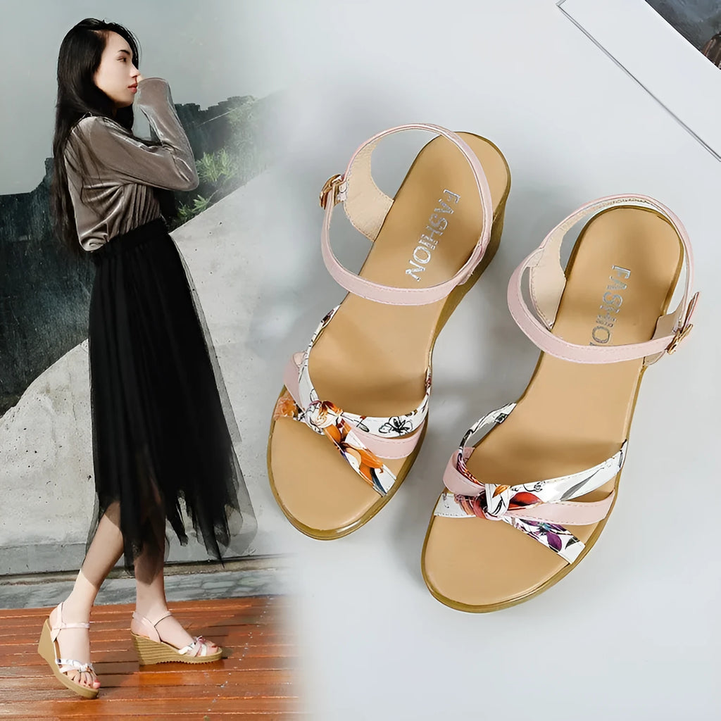 Women's pink wedge sandals with a thick heel, non-slip sole, and a single buckle fastening.