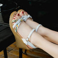 Women's pink wedge sandals with a thick heel, non-slip sole, and a single buckle fastening.