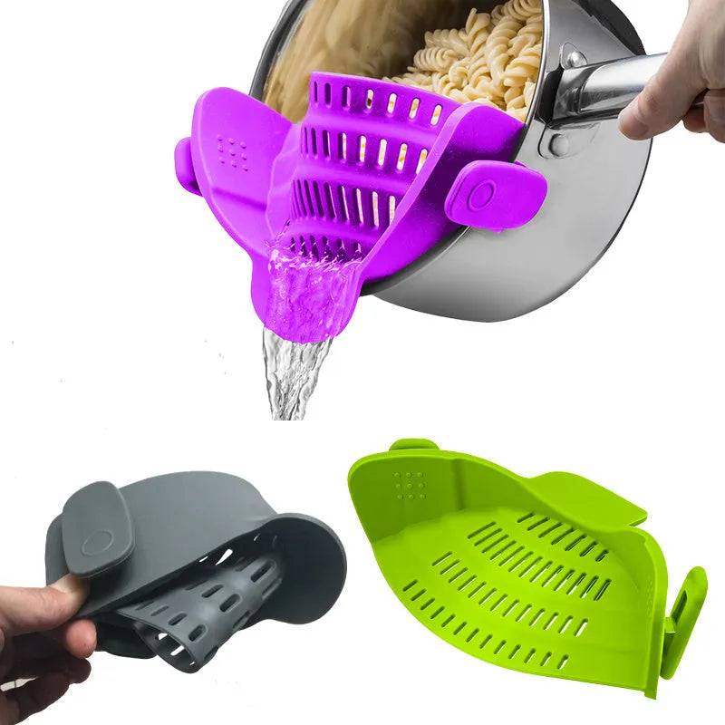 Silicone clip-on funnel colander in kitchen draining liquid from pot
