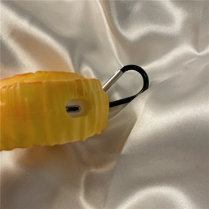 Yellow silicone AirPods case with butter cookie design, compatible with AirPods 1, 2, Pro, and 3.