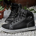 A pair of black casual short motorcycle boots for men, showcasing a breathable summer design with a non-slip sole.