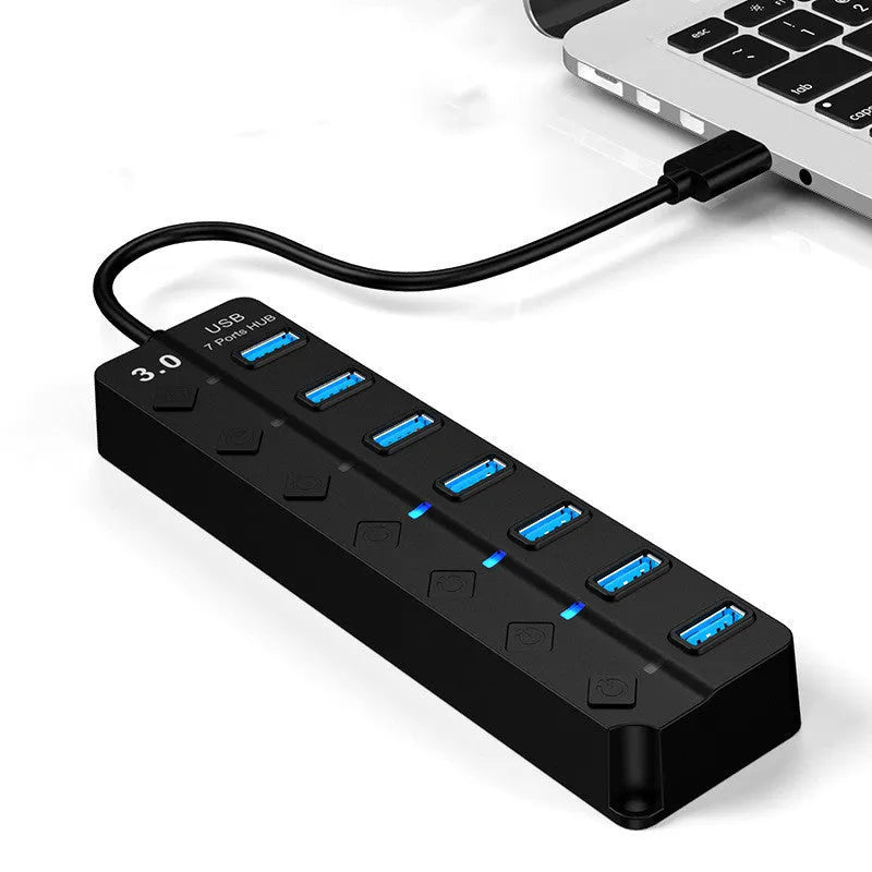 Black 7-port USB 3.0 hub with individual power switches and external power adapter