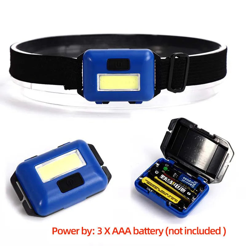 Compact blue outdoor LED headlamp with an adjustable black polyester strap, showing the COB bulb and control button.