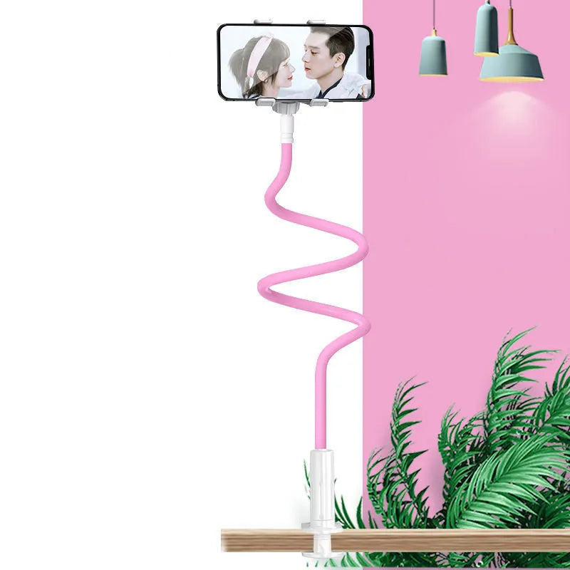 Blue clamp-on mobile phone holder with flexible memory alloy arm attached to a bedside table