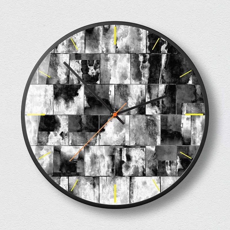 Round abstract art wall clock with metal case and black design options in 12 and 14 inch sizes