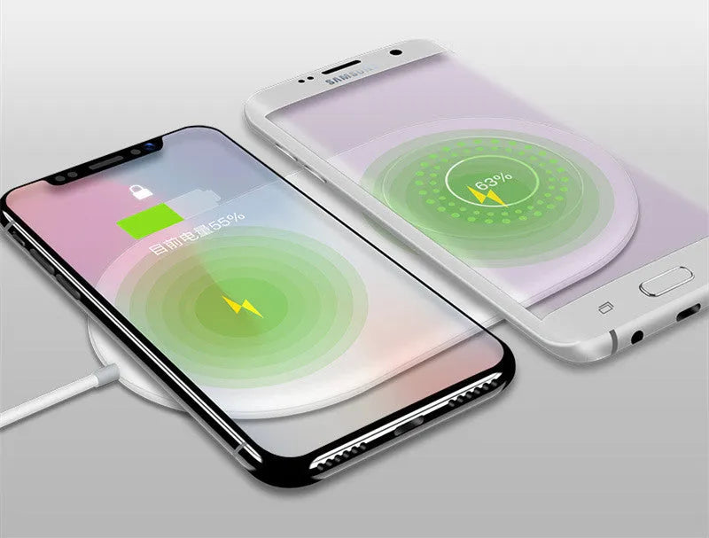 White dual wireless phone charger showing two phones charging simultaneously on minimalist charging pad