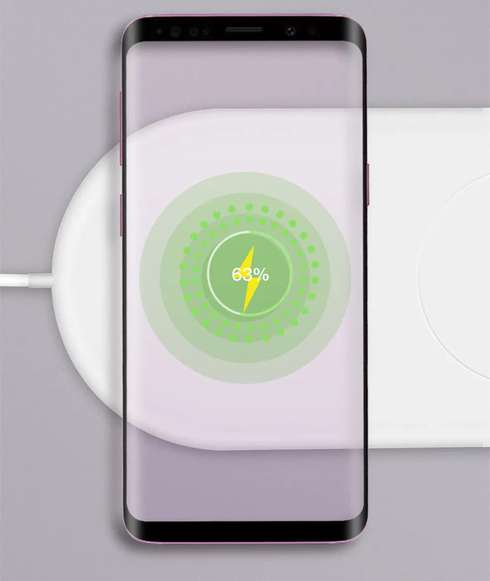 White dual wireless phone charger showing two phones charging simultaneously on minimalist charging pad