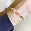 Pink UG309 geometric women's bracelet made with natural freshwater pearls and strawberry crystals.