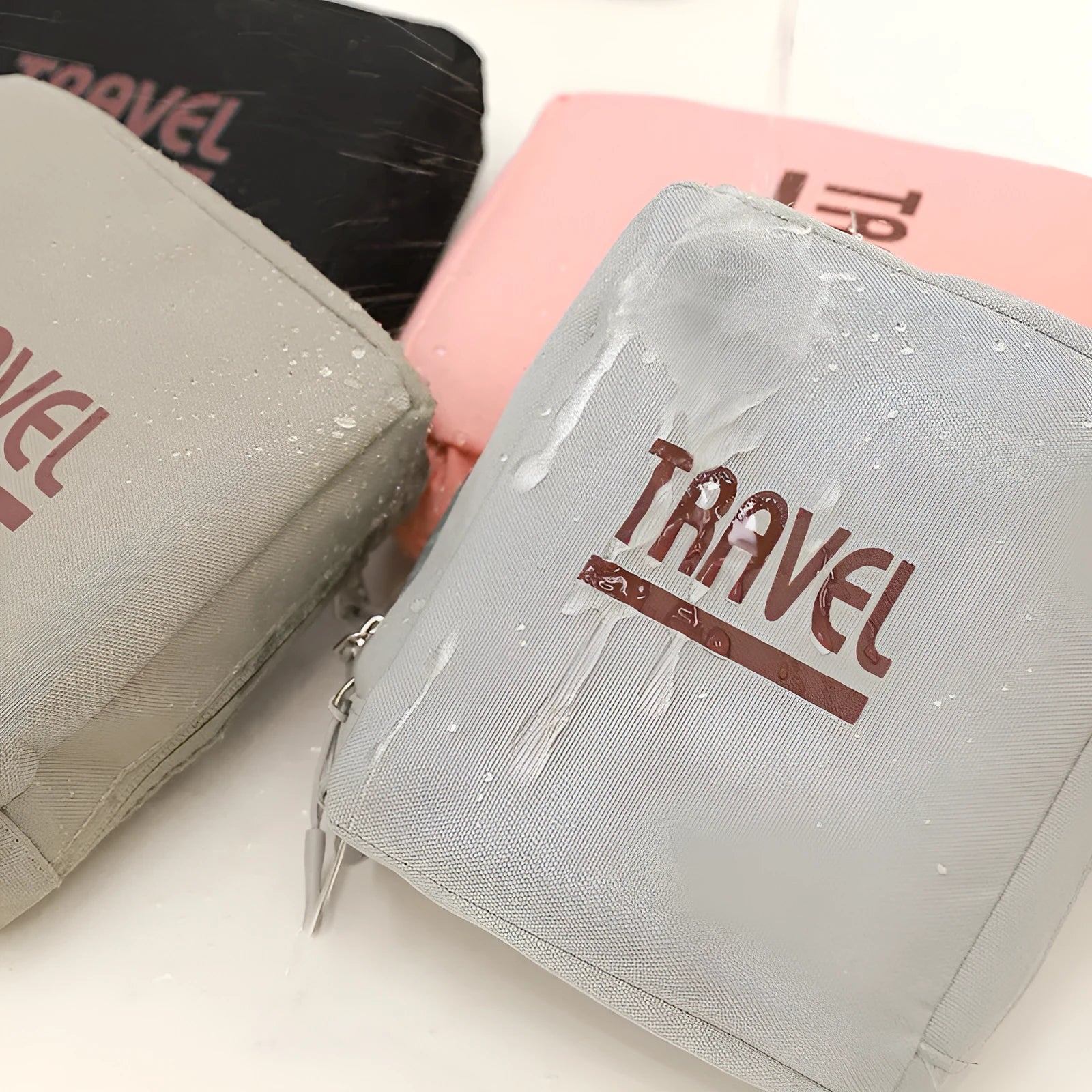 Black cube-shaped portable travel storage bag made from Oxford cloth with a sealed closure.