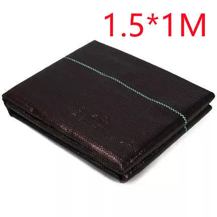 Black composite woven PE weed cloth roll for farmland and greenhouse weed suppression.