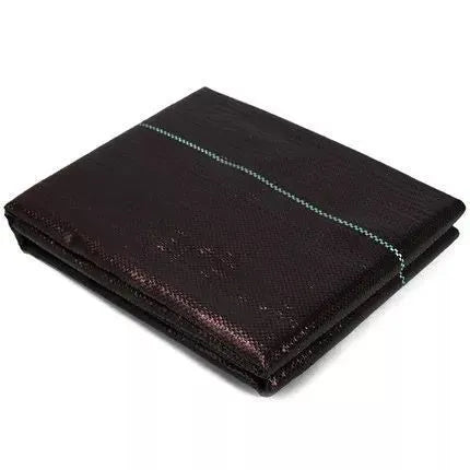 Black composite woven PE weed cloth roll for farmland and greenhouse weed suppression.