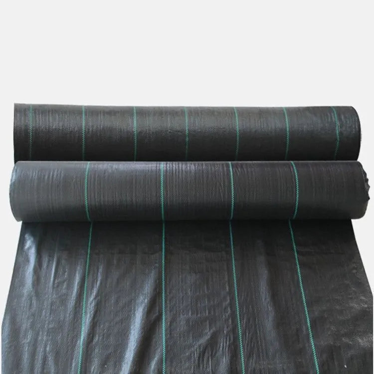 Black composite woven PE weed cloth roll for farmland and greenhouse weed suppression.