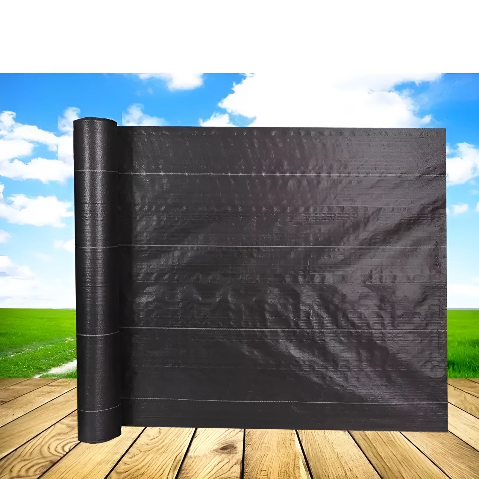 Black composite woven PE weed cloth roll for farmland and greenhouse weed suppression.