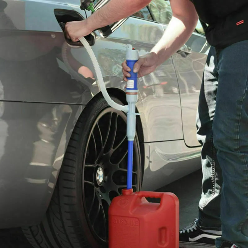 Red and blue manual hand pump siphon for transferring fuel oil and gasoline