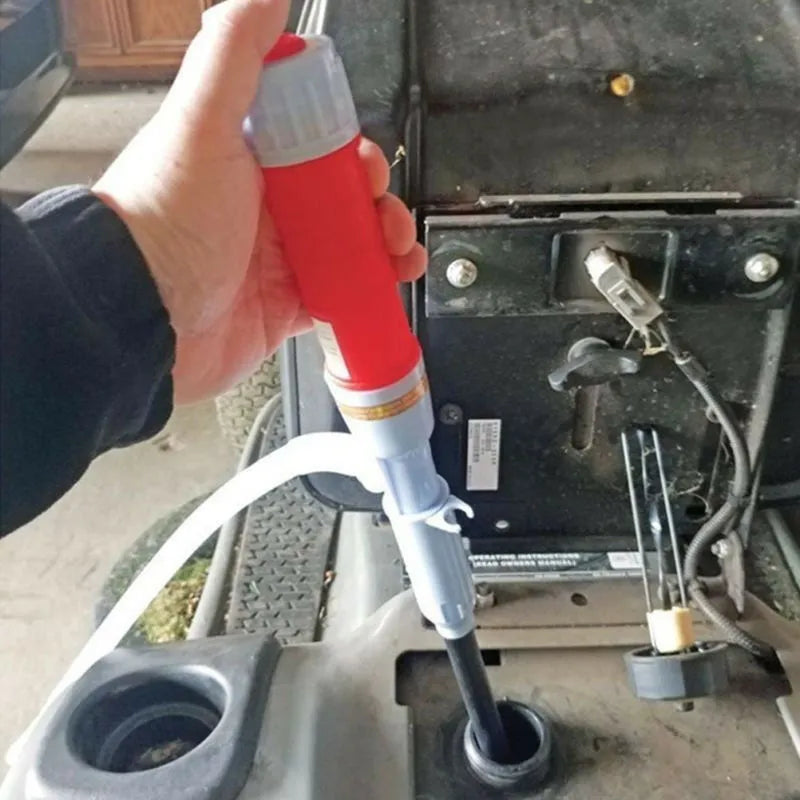 Red and blue manual hand pump siphon for transferring fuel oil and gasoline
