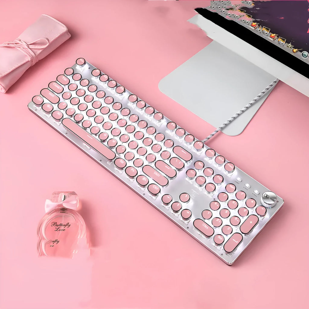 Pink and silver mechanical keyboard with white backlighting and green switches