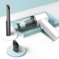 Black and white wireless handheld car vacuum cleaner with compact ABS plastic body.