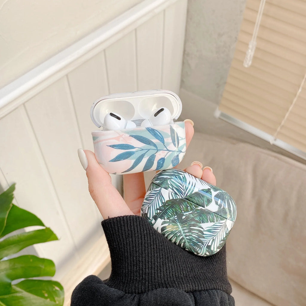 Blue and green banana leaf design soft TPU protective case for Apple AirPods.