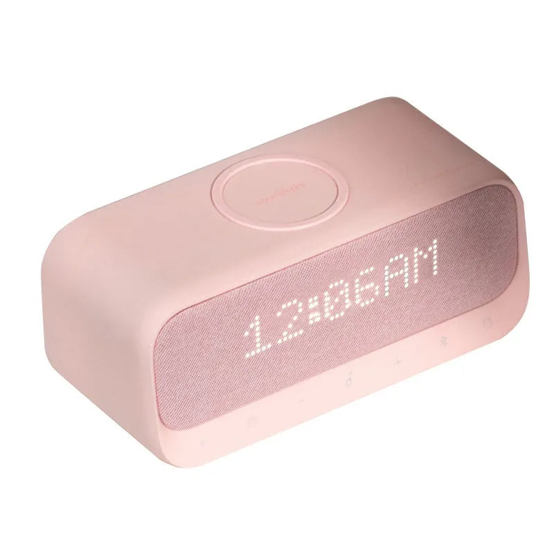 Anker Soundcore pink and white Bluetooth speaker with wireless charging top and LED display