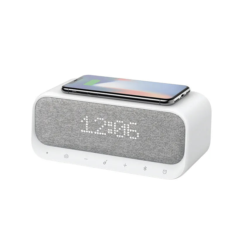Anker Soundcore pink and white Bluetooth speaker with wireless charging top and LED display