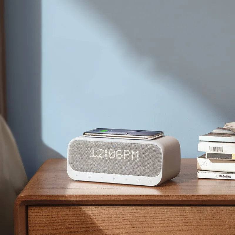Anker Soundcore pink and white Bluetooth speaker with wireless charging top and LED display
