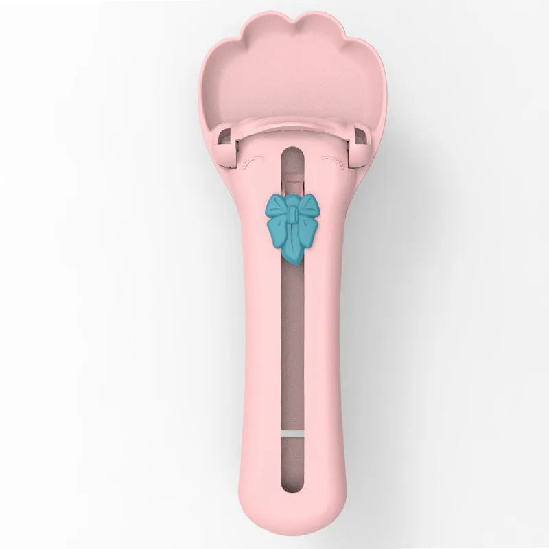 Pet food scoop dispenser with long silicone tubing and a set of five coloured nozzle heads on a green background.