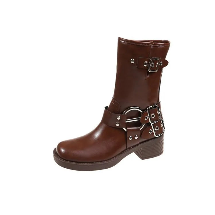 Women's black leather platform boots with belt buckle detail at mid-calf height