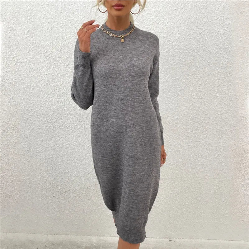 Grey women's casual sweater dress with a crew neck and long sleeves on a hanger.