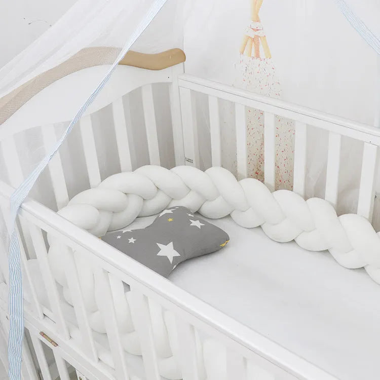 Braided knot cot bumper cushion in spandex velvet for crib safety protection.