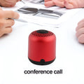 Hieha XQ11 cylindrical mini portable Bluetooth speaker in silver colour on a table.