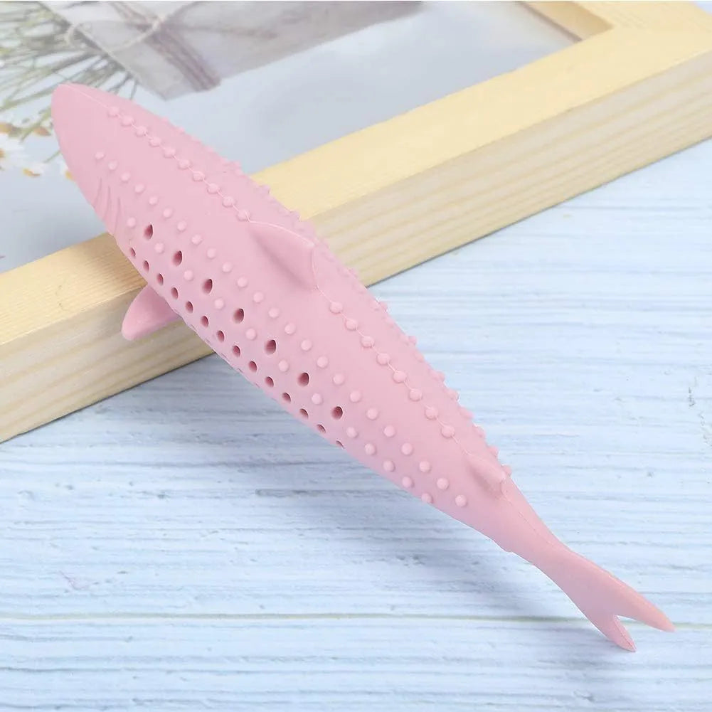 Green fish-shaped silicone chew toy for cats with visible side holes and a removable section for catnip.