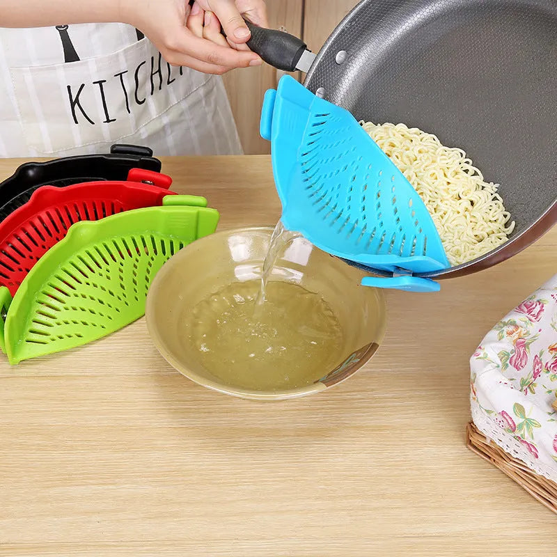 Silicone clip-on funnel colander in kitchen draining liquid from pot