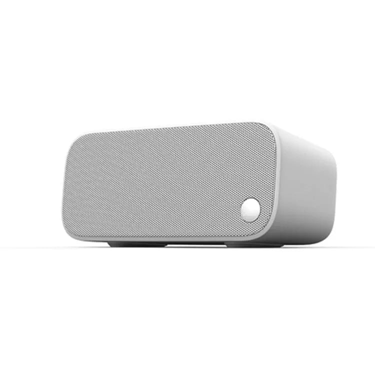 Elf sugar cube artificial intelligence smart WiFi speaker in blue, green, red, or white colours with front-facing bookshelf design