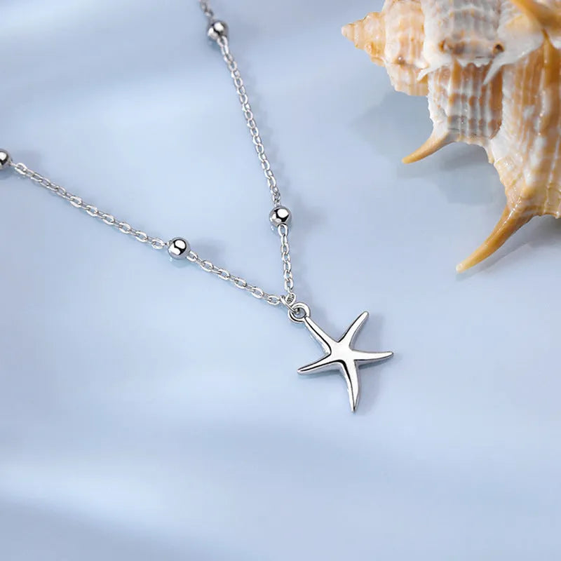 Women's sterling silver anklet with a starfish charm on a round bead chain