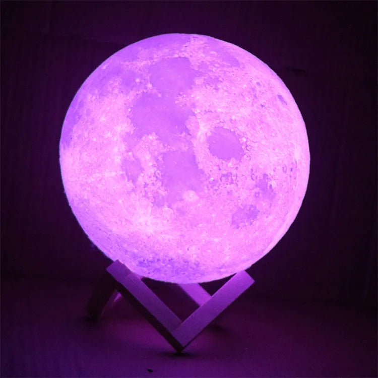 3D printed white moon lamp with textured surface on a wooden stand, showing touch ring at base.