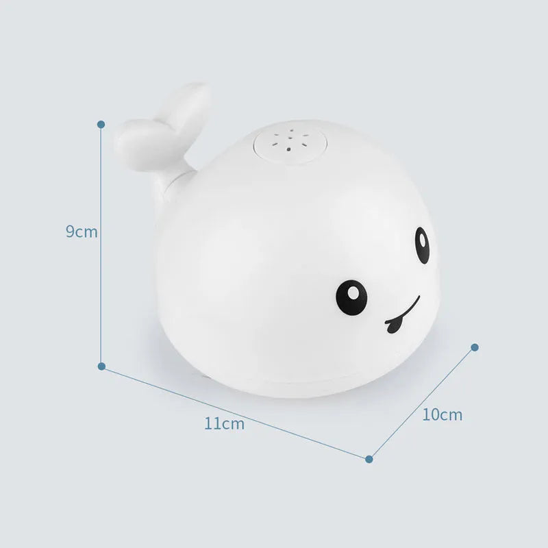 Electric whale bath toy spraying water with flashing LED lights in baby bath