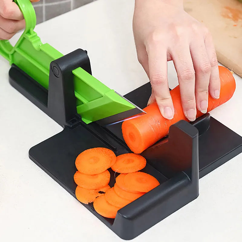 Green and red modern vegetable cutter with stainless steel blades for slicing carrots and potatoes