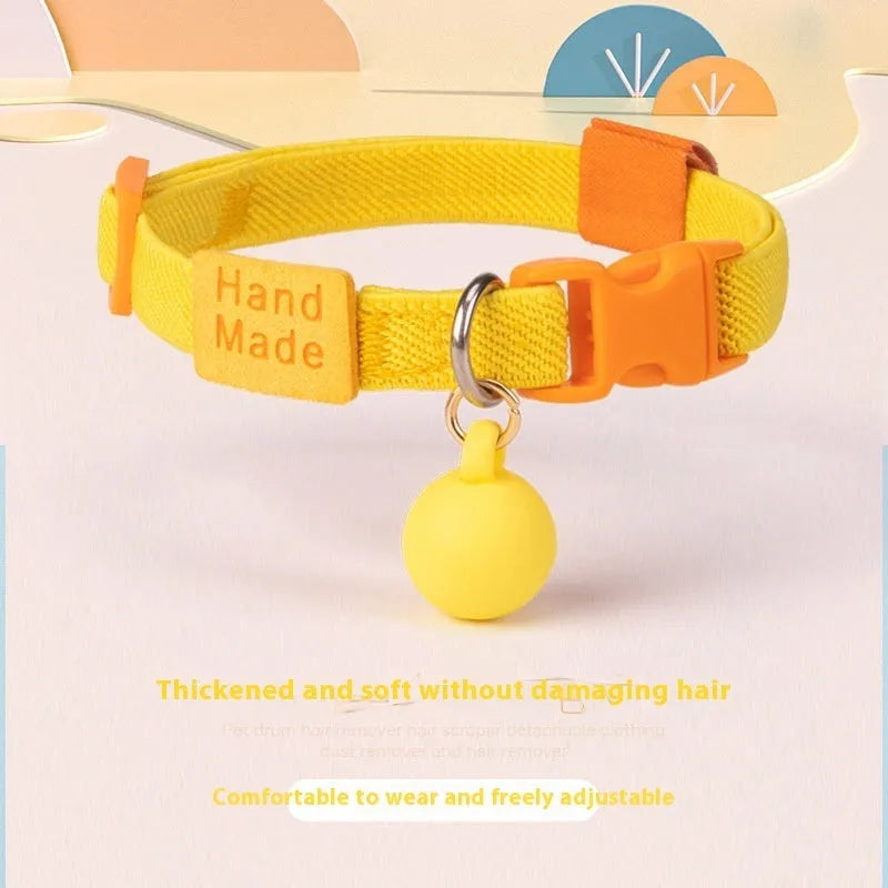 A small dog's polyester elastic pet collar in a solid colour with a monochrome pattern.