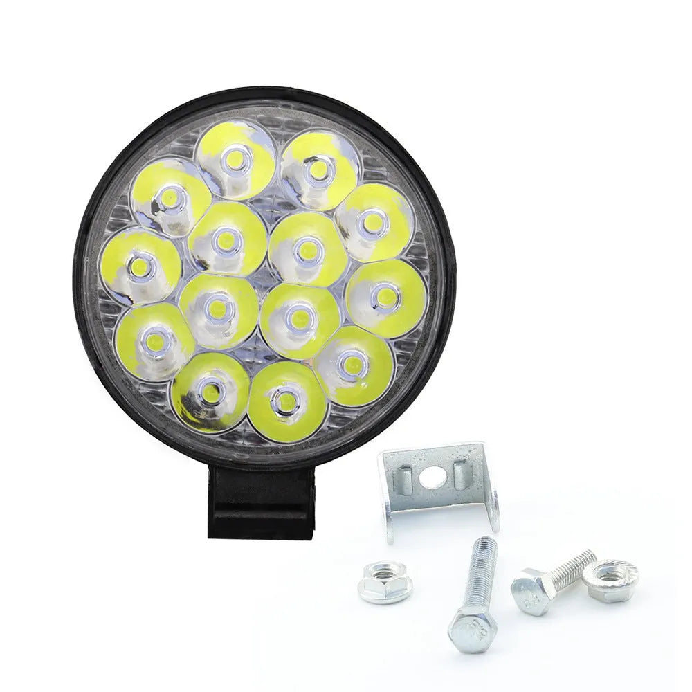 White mini round 42W LED work light with aluminium housing for vehicle mounting.