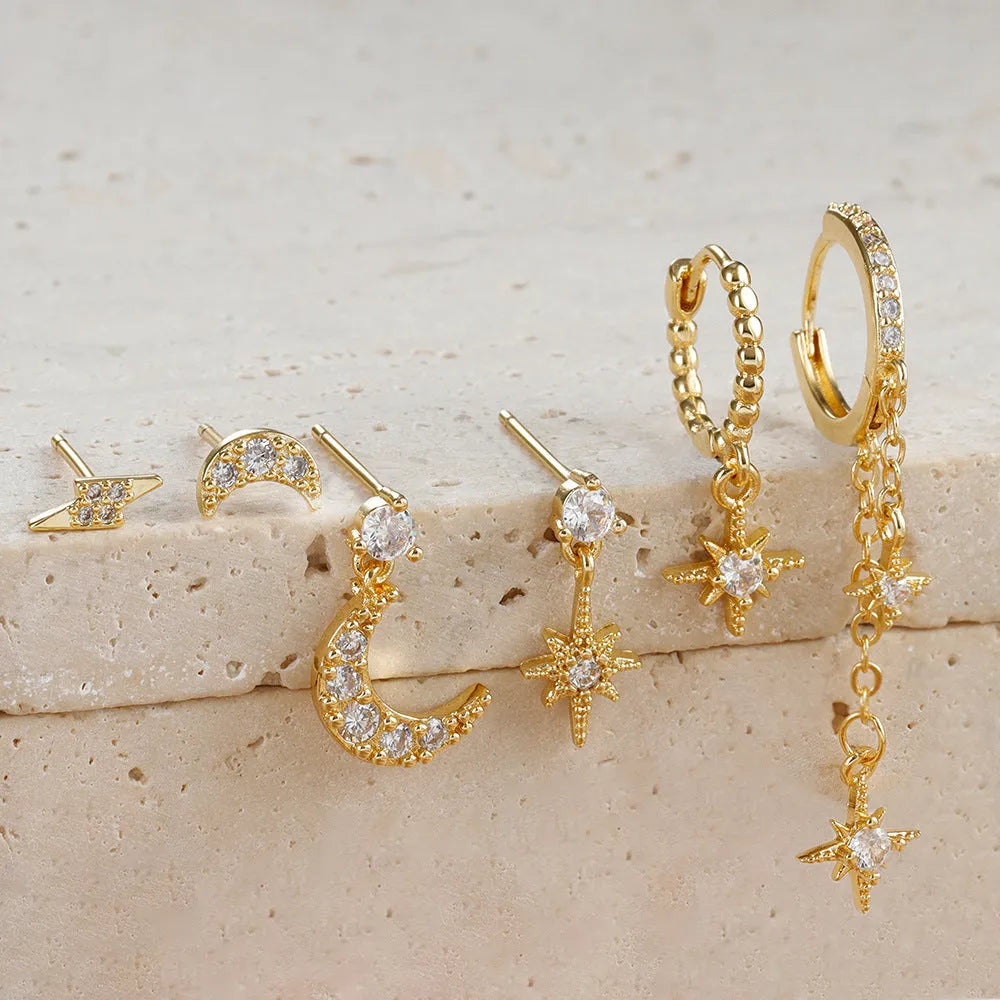 Set of six gold-coloured chain tassel earrings with zircon studs for women.